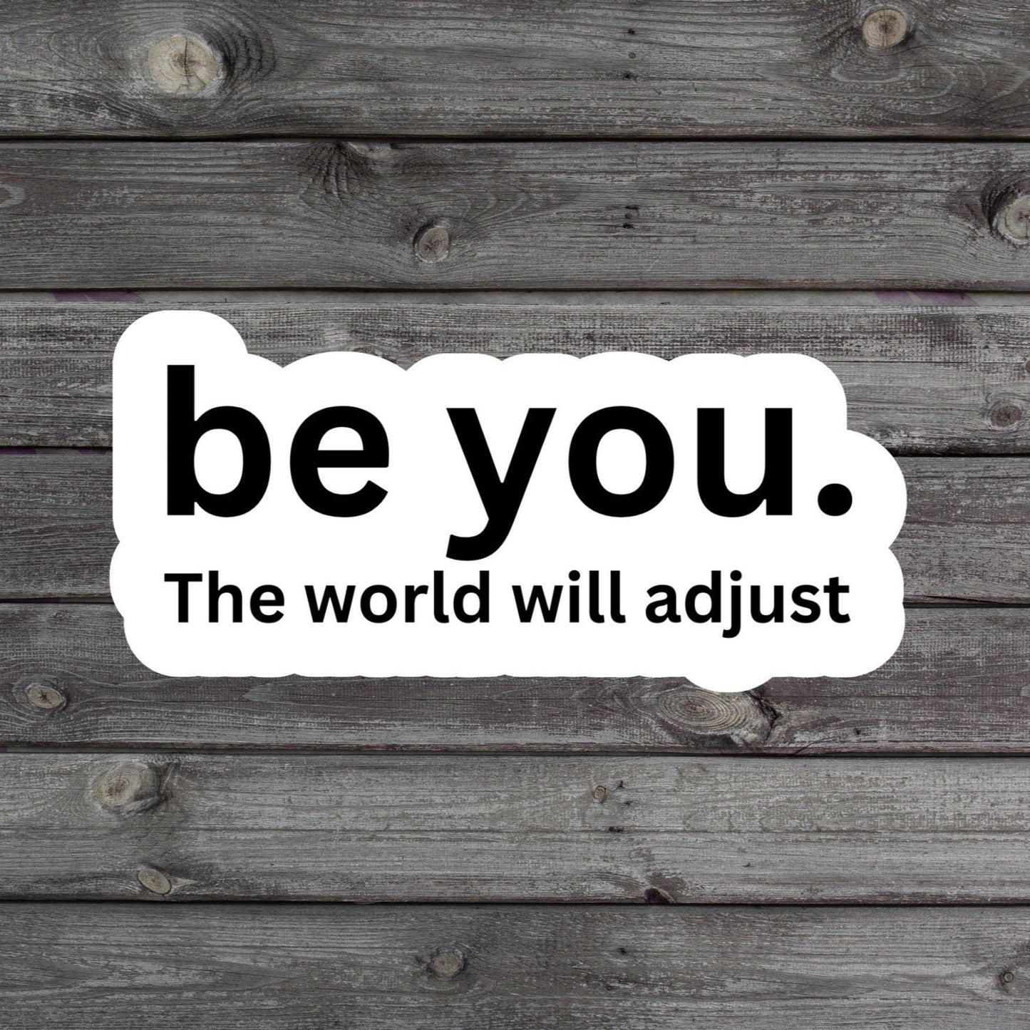 Sticker with the empowering text 'Be You The World Will Adjust' in a bold and confident style