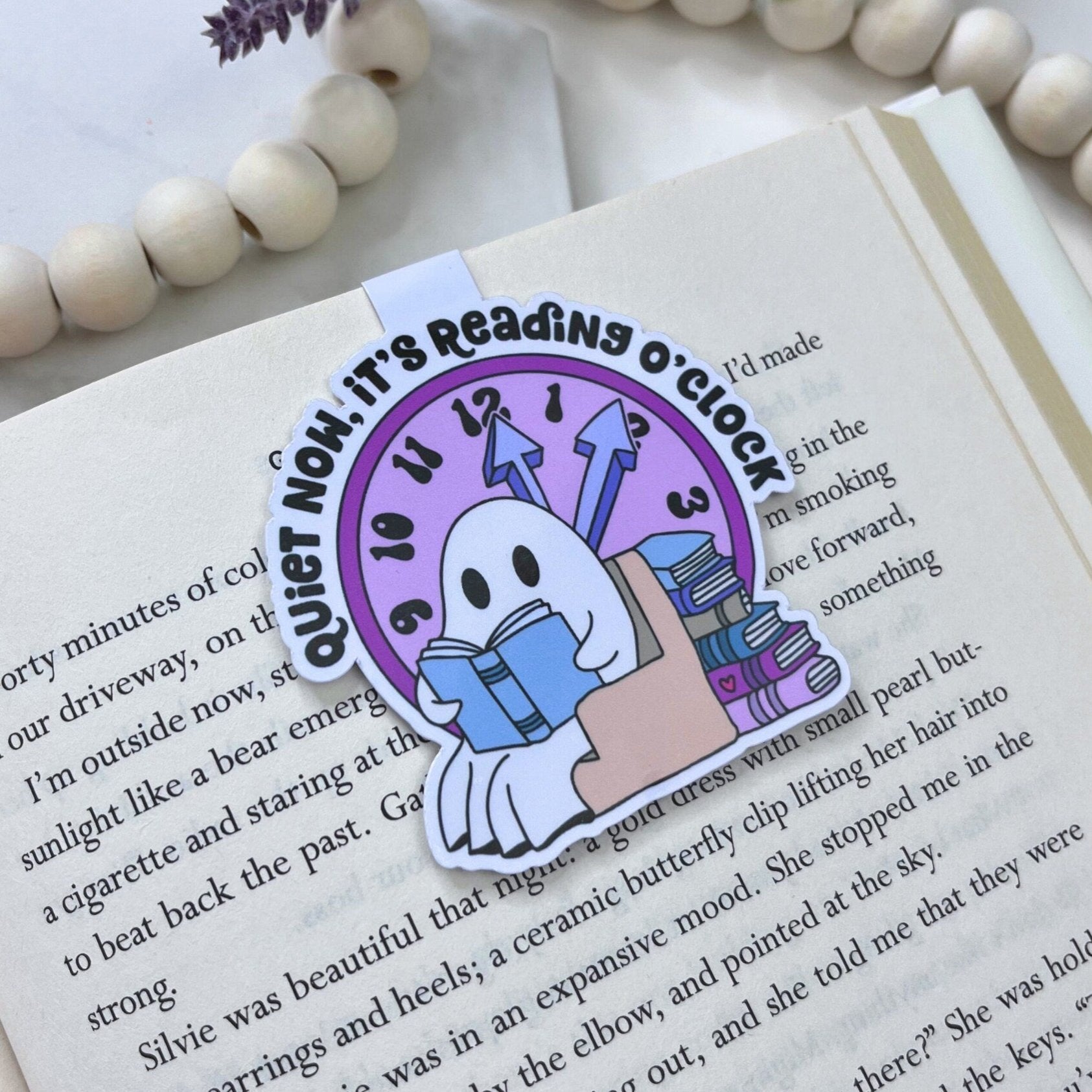 Magnetic bookmark with a bookish ghost and the text 'Quiet Now, It's Reading O'Clock' in a whimsical style