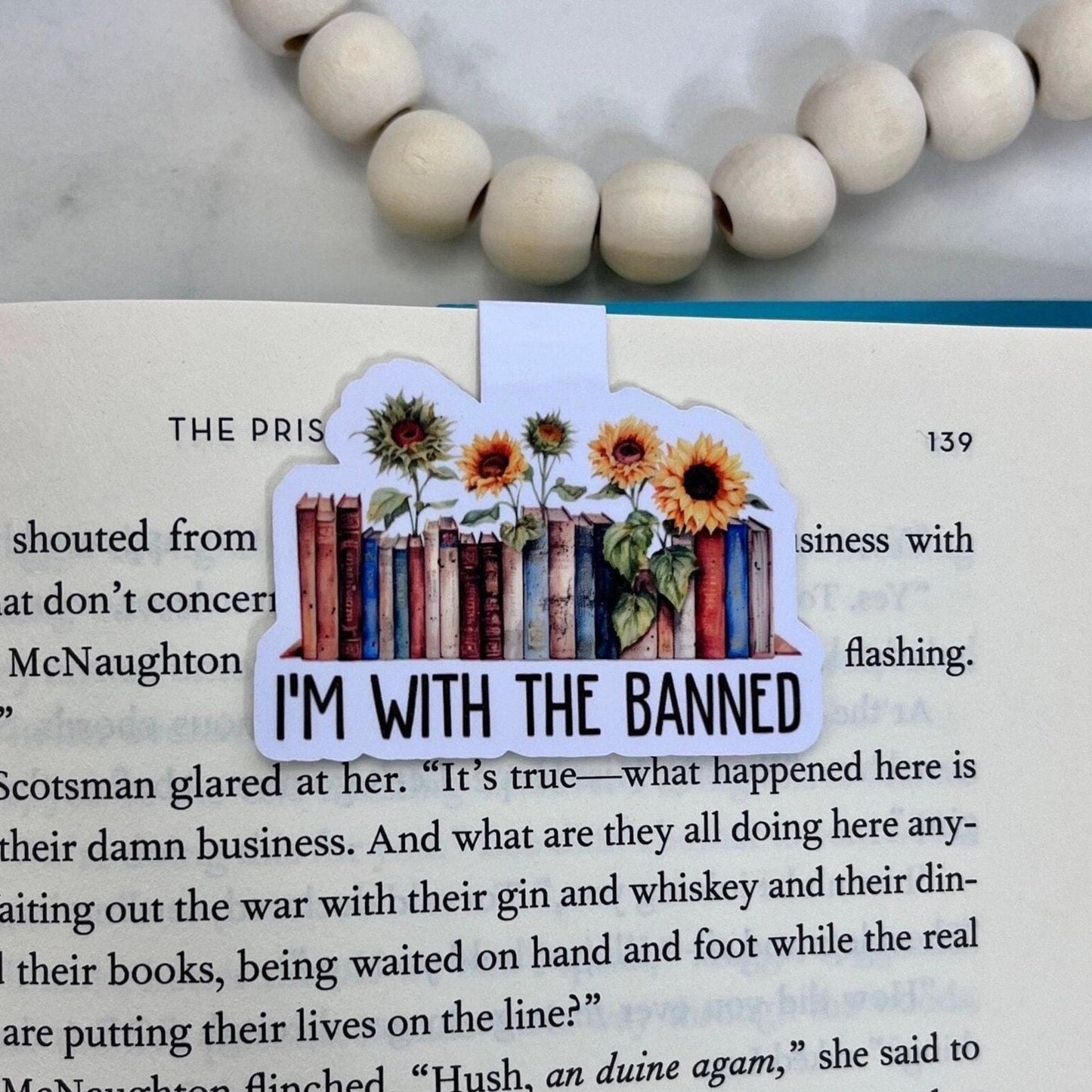 Magnetic bookmark with the phrase 'I'm With The Banned Books' in a bold and rebellious style, likely accompanied by imagery related to banned books