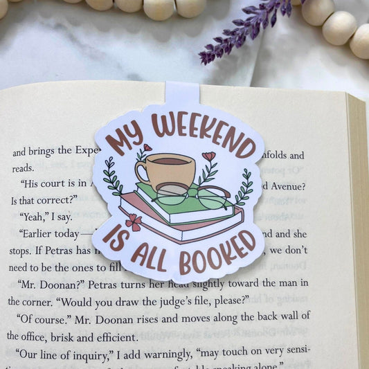 Magnetic bookmark with the phrase 'My Weekend Is Booked' in a playful design, possibly with book-related imagery